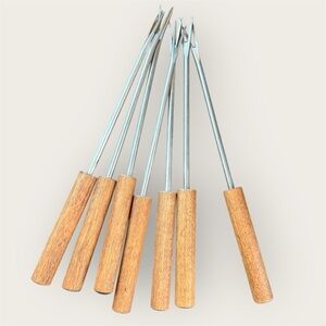 Vintage mid-century stainless steel fondue forks with teak wood handles